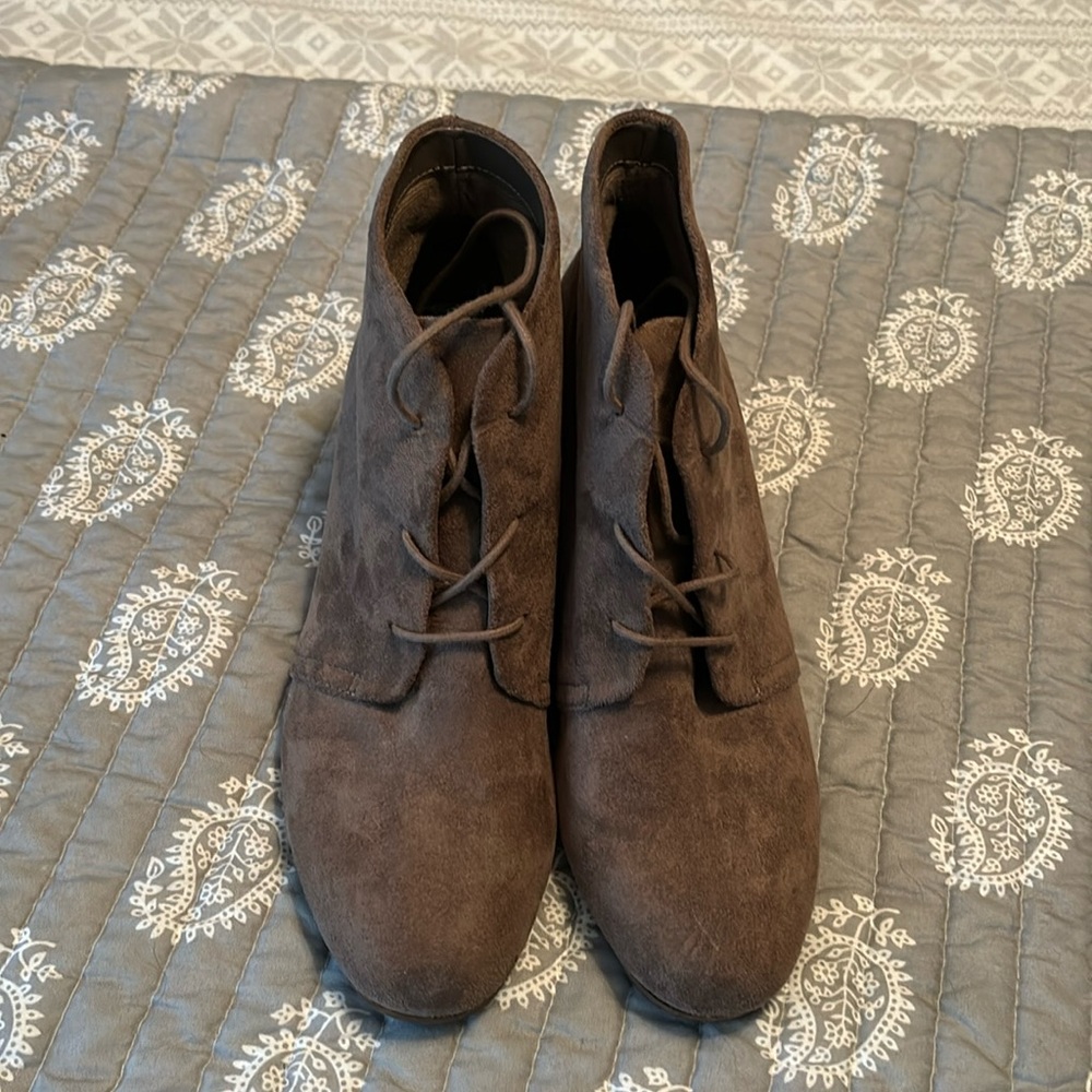 Women’s brown suede wedges.